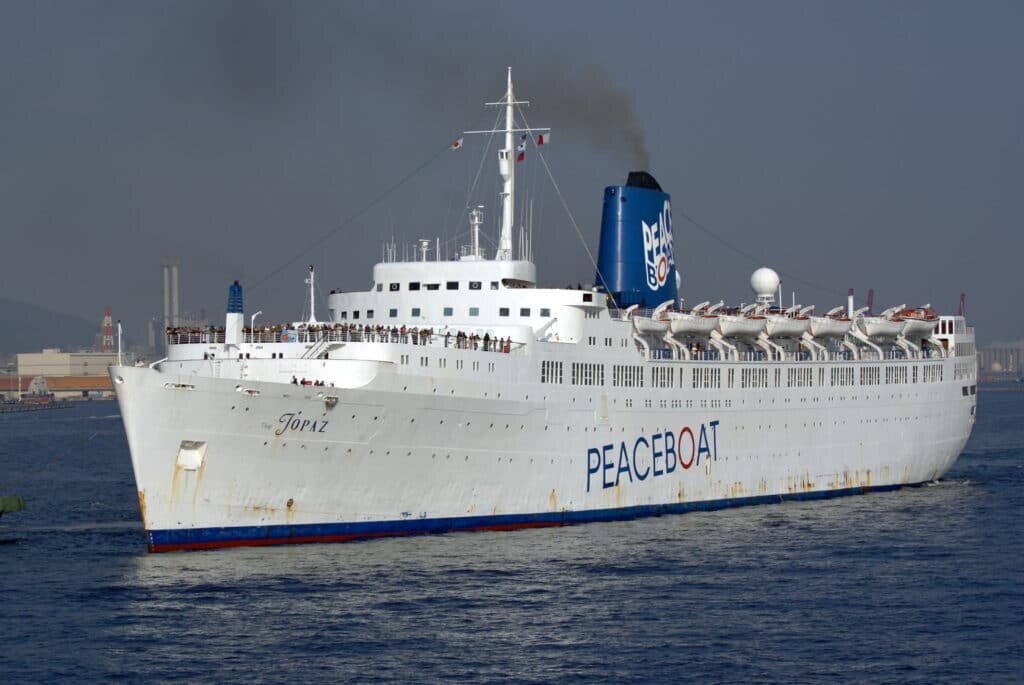 The Topaz, a ship used by Peace Boat during the 2000s. Source: Wikipedia https://commons.wikimedia.org/wiki/File:Kobe_topaz01s3200.jpg